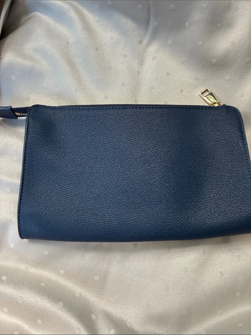 Fair condition Tory Burch Dark Navy Leather Zip pouch with Gold Logo